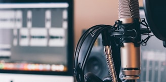 black and silver headphones on black and silver microphone