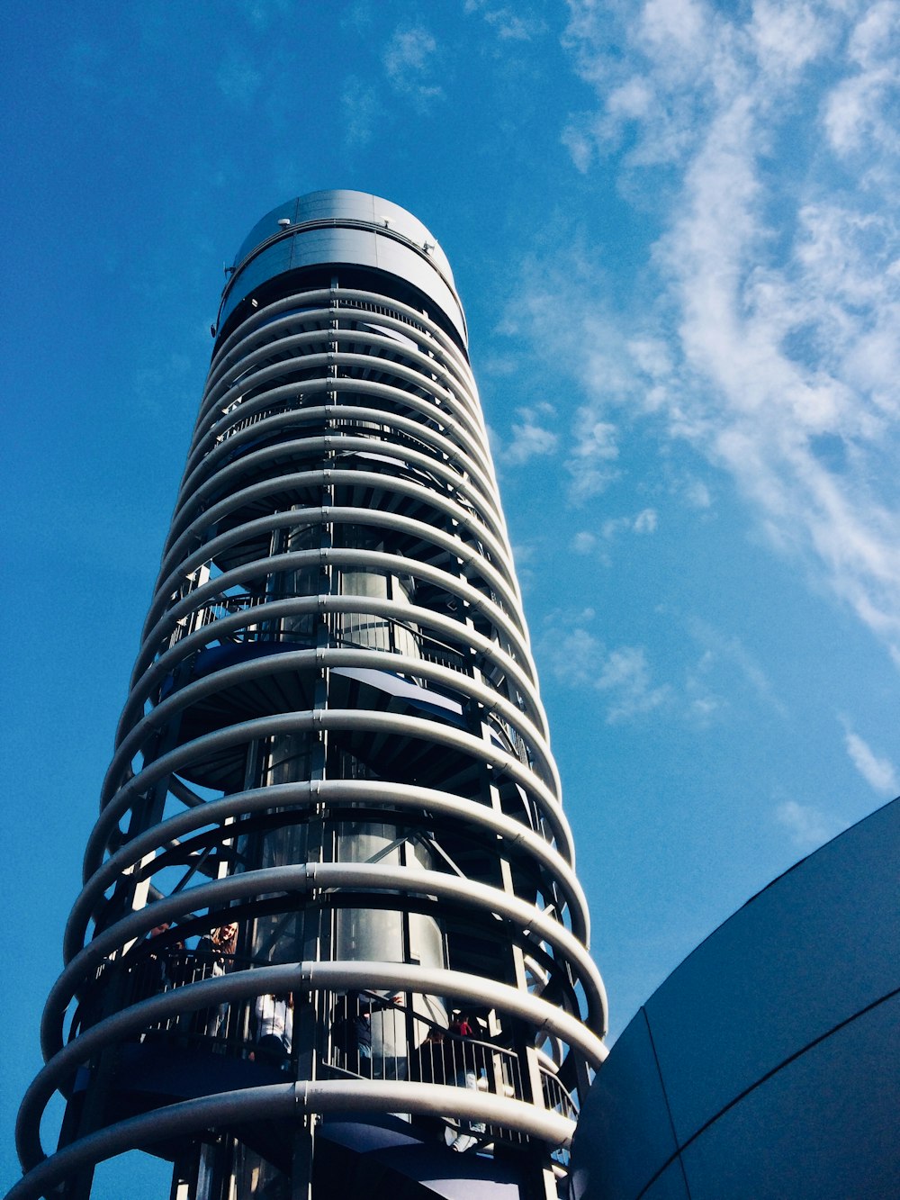 white and black high rise building under blue sky during daytime