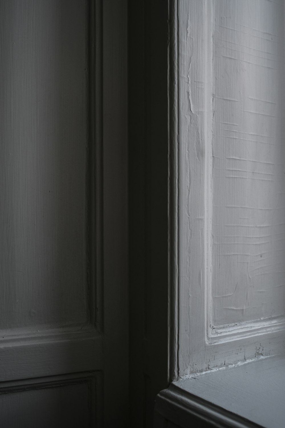 white wooden door with white wooden frame