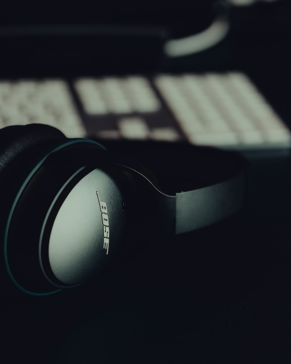 black and white sony headphones on macbook pro