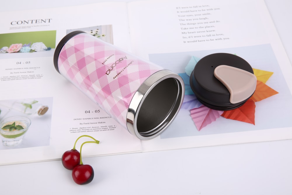 pink and black travel mug