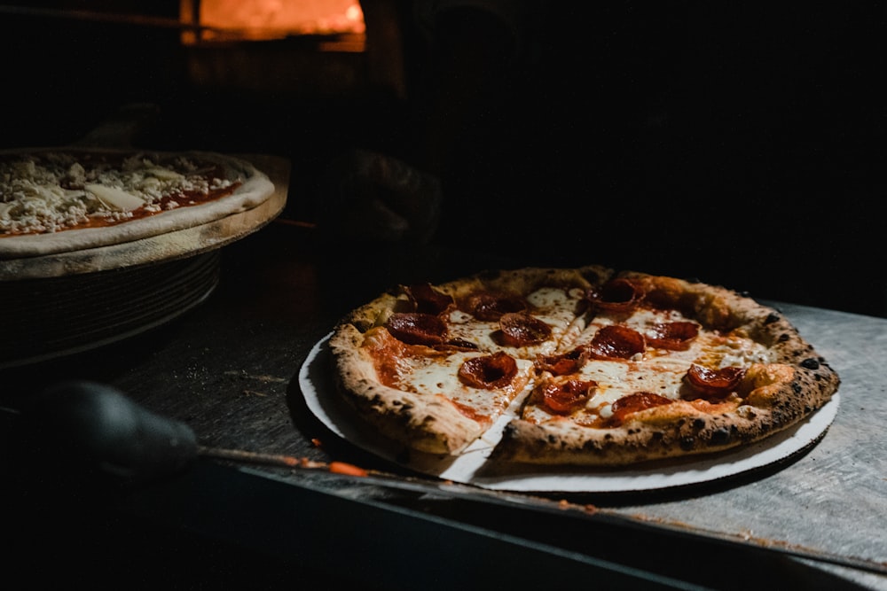 pizza on black wooden table