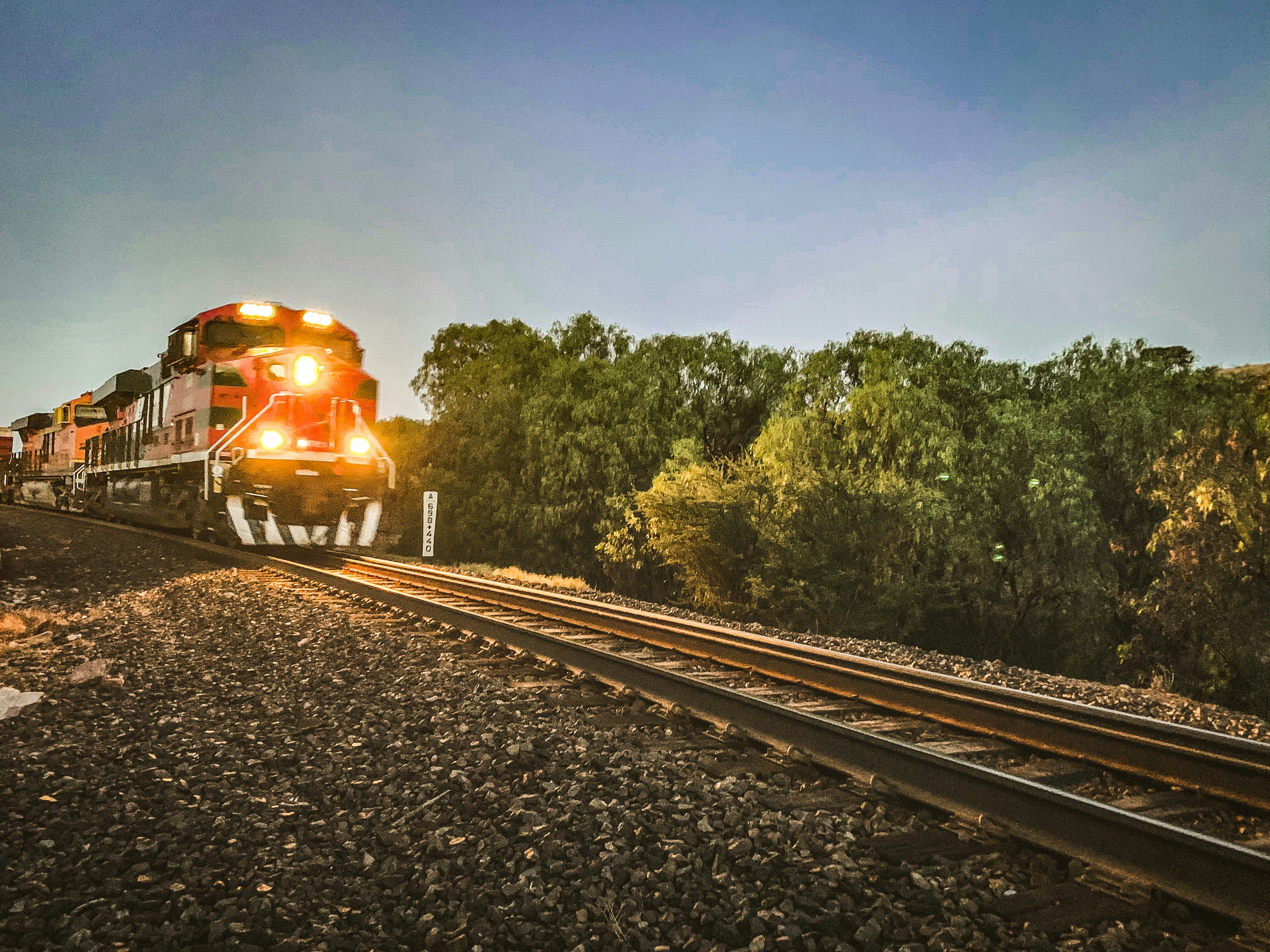 yellow train on rail tracks during daytime