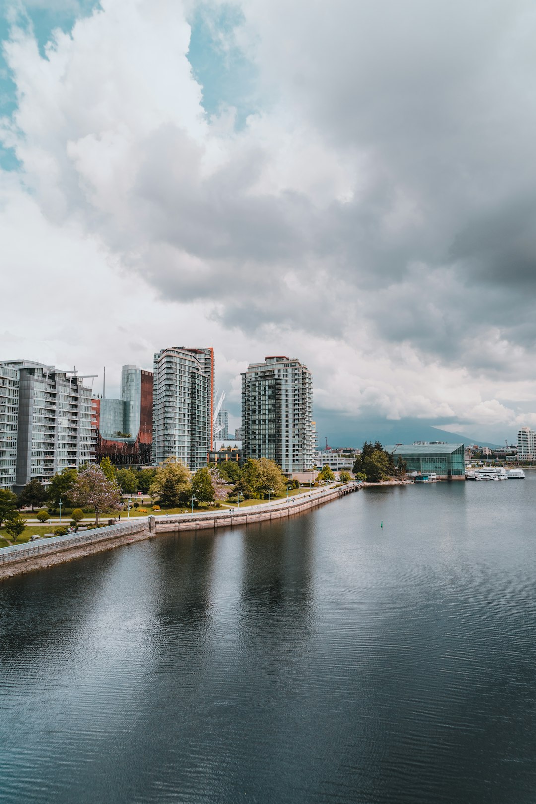 city skyline under cloudy sky during daytime