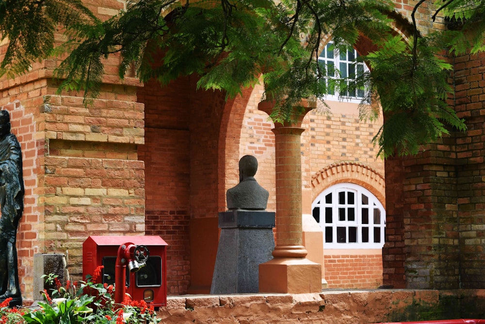 brown brick building with green trees