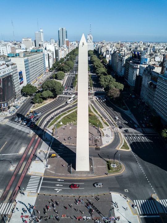 cars on road near city buildings during daytime in Obelisco Argentina