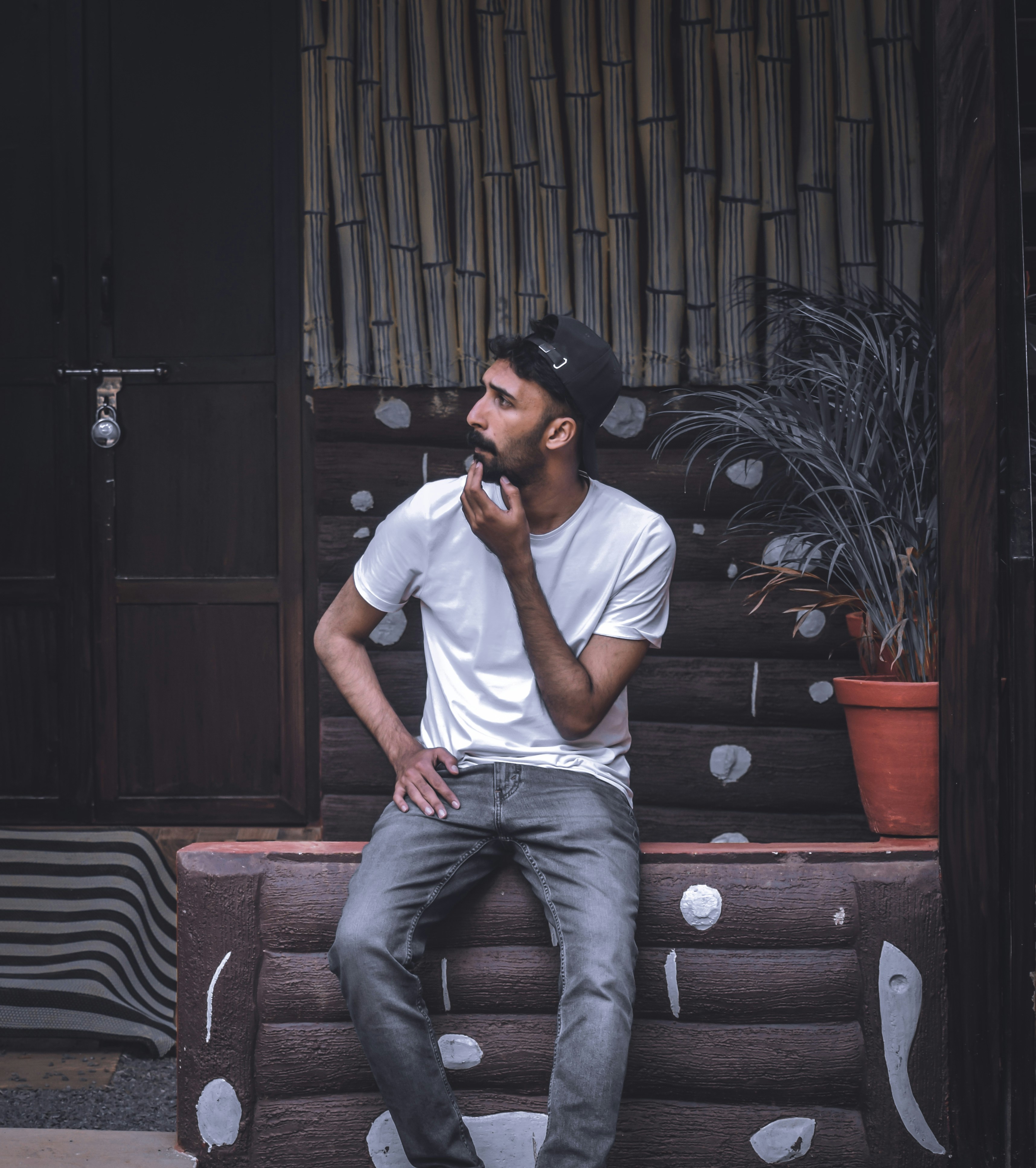 white polo shirt and blue jeans