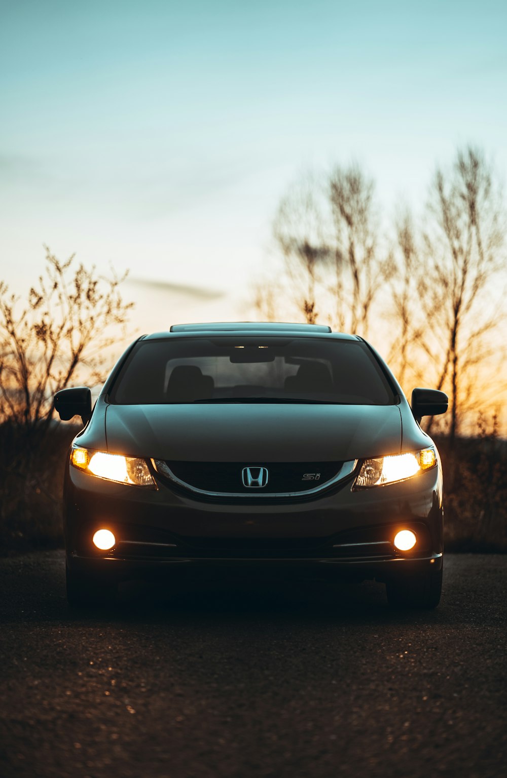 black honda car on road during daytime