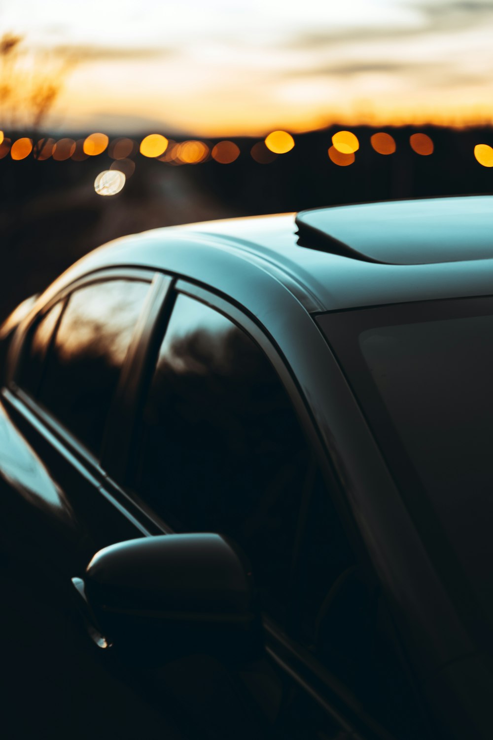 black car in bokeh photography