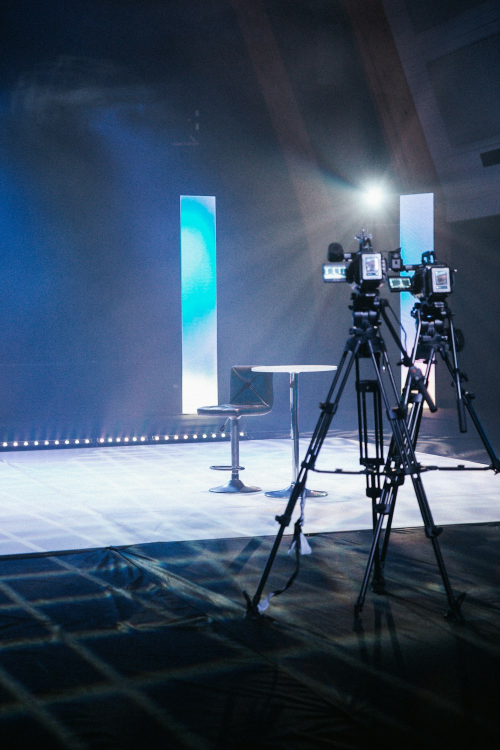 a camera set up on a tripod on a stage