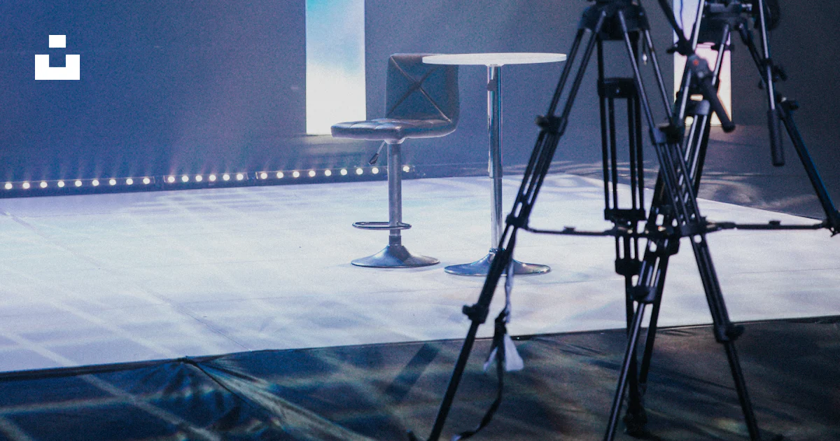 Stage Camera Setup A camera set up on a tripod on a stage photo – Free Blue Image on Unsplash