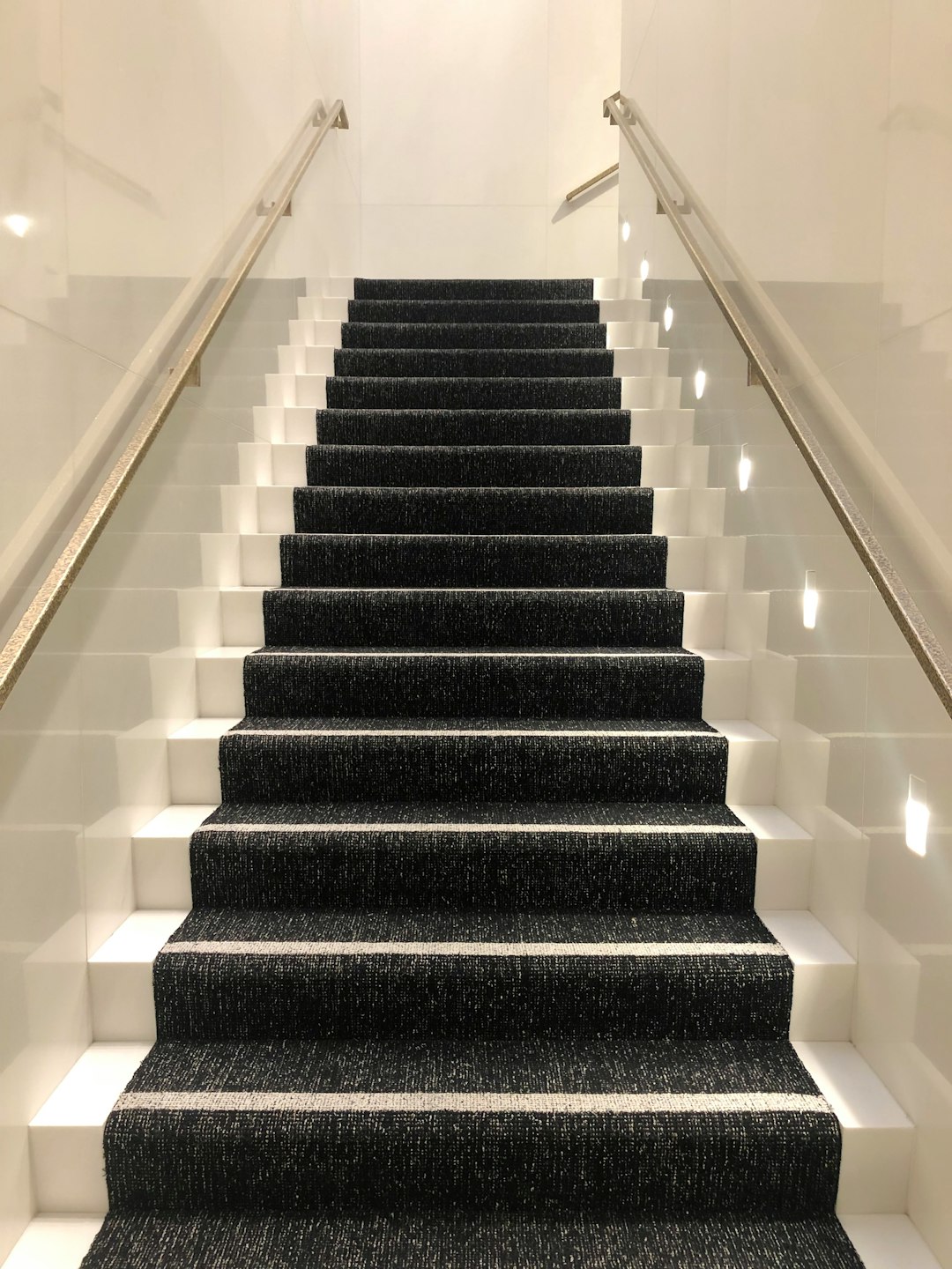 black and white staircase with white railings