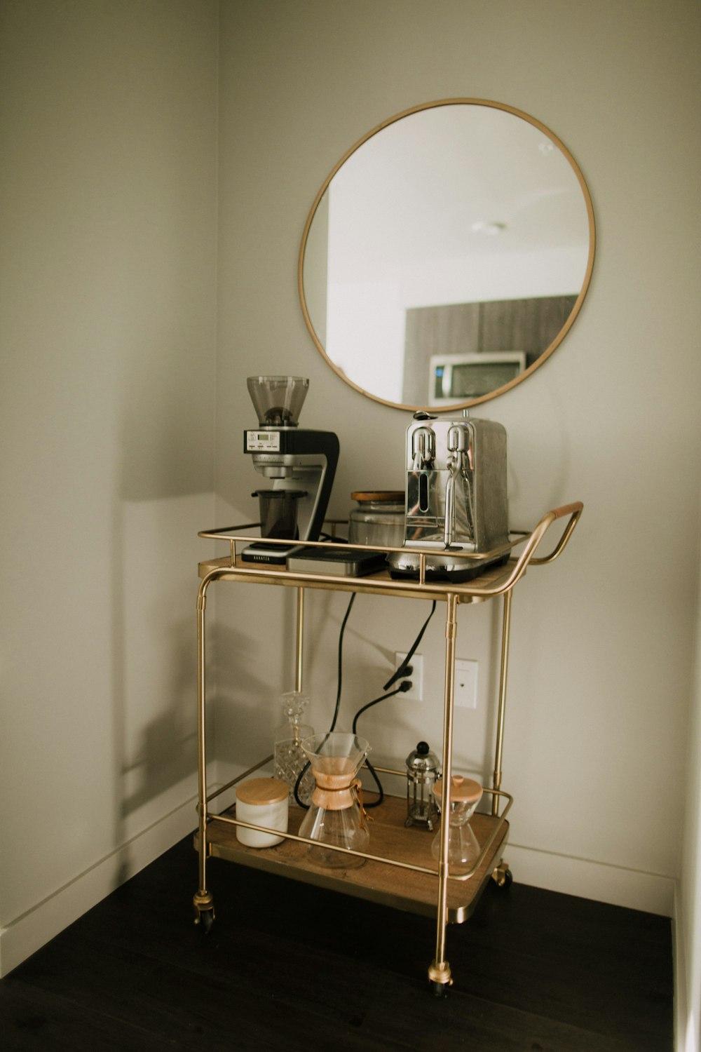 black and silver coffee maker on brown wooden table