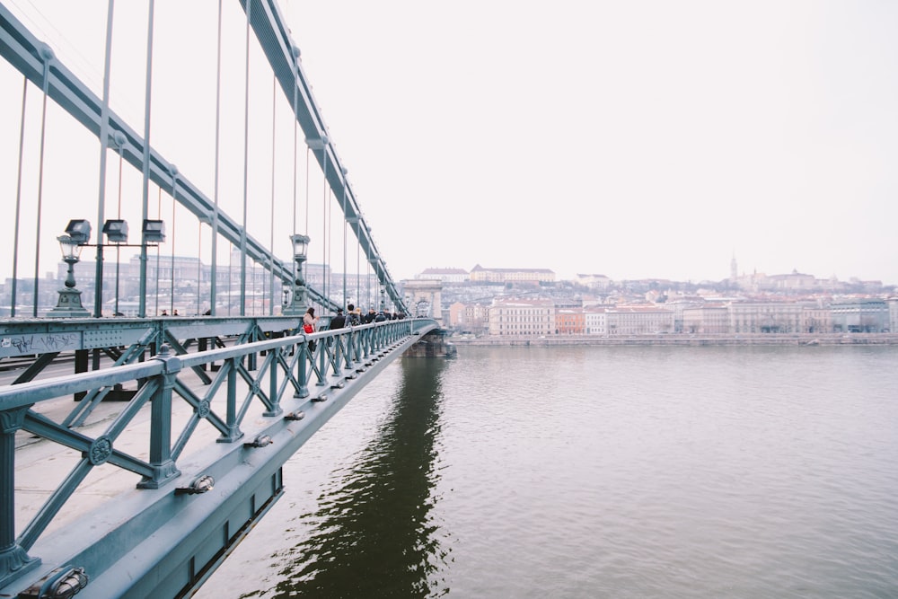 white and brown concrete bridge over river during daytime