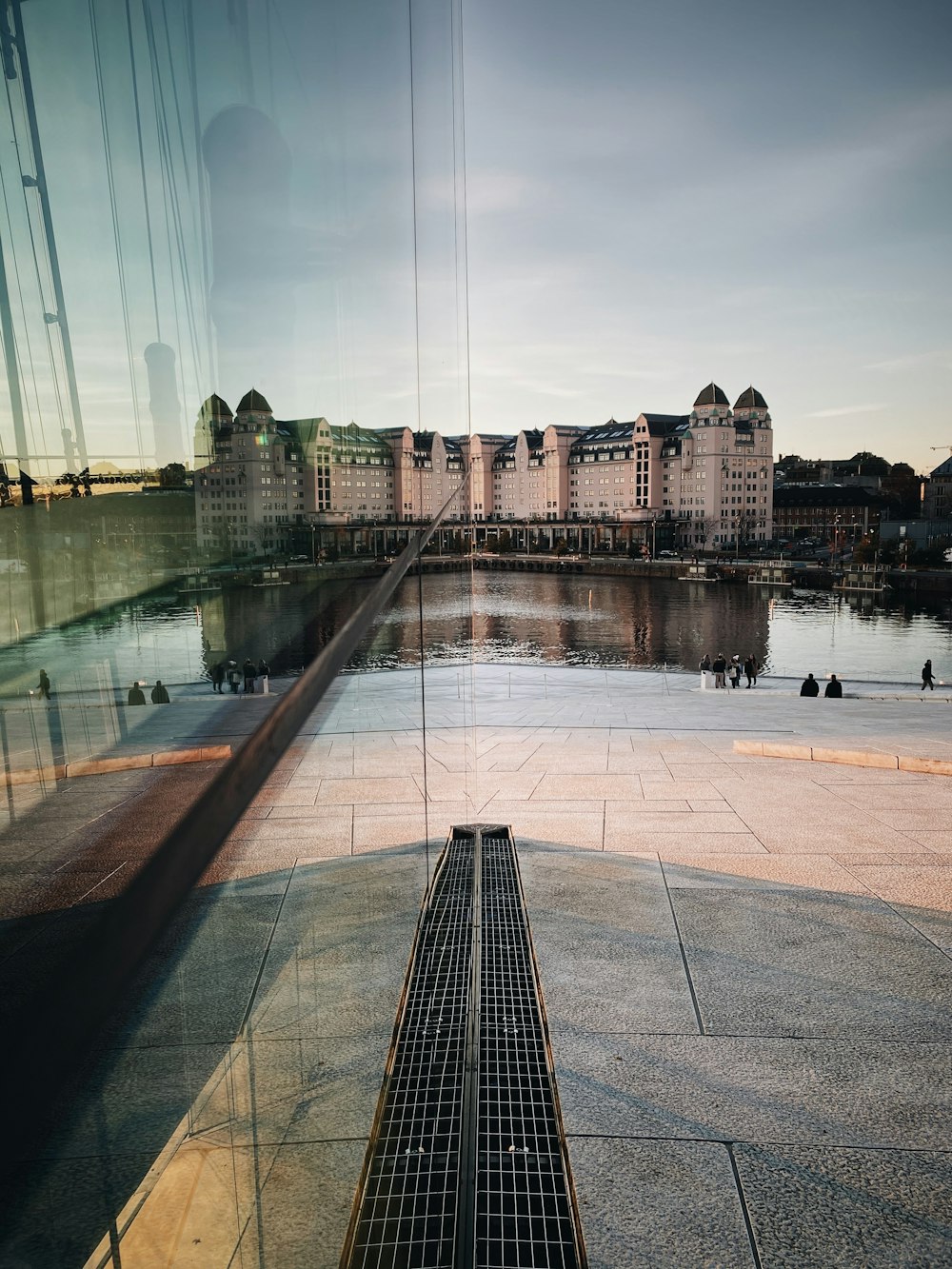 brown concrete building near body of water during daytime