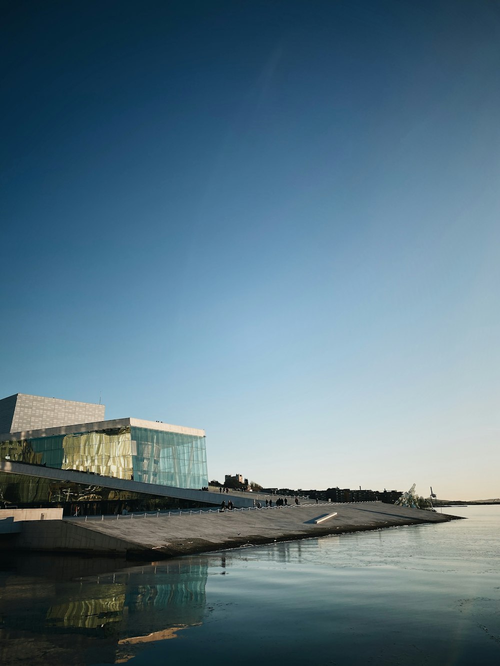 white concrete building near sea during daytime