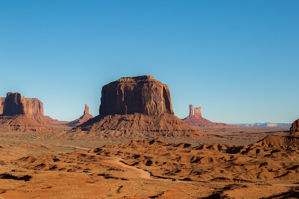 brown rock formation under blue sky during daytime