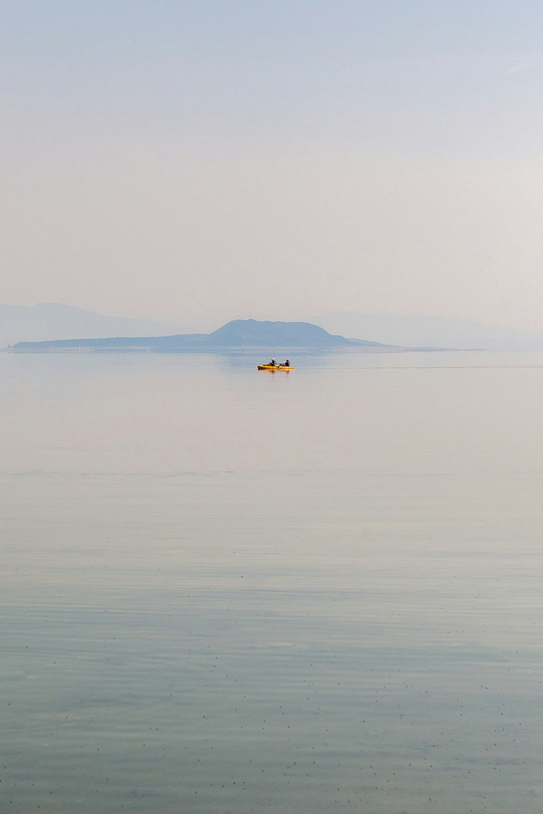 person riding on boat on sea during daytime