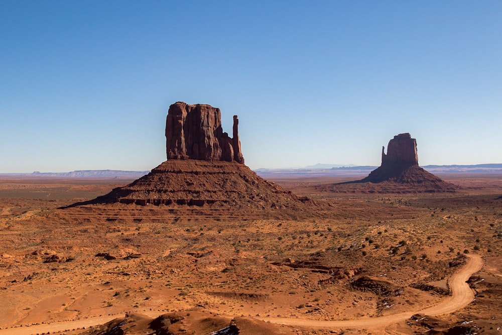 brown rock formation under blue sky during daytime