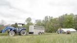 a tractor and a trailer in a field