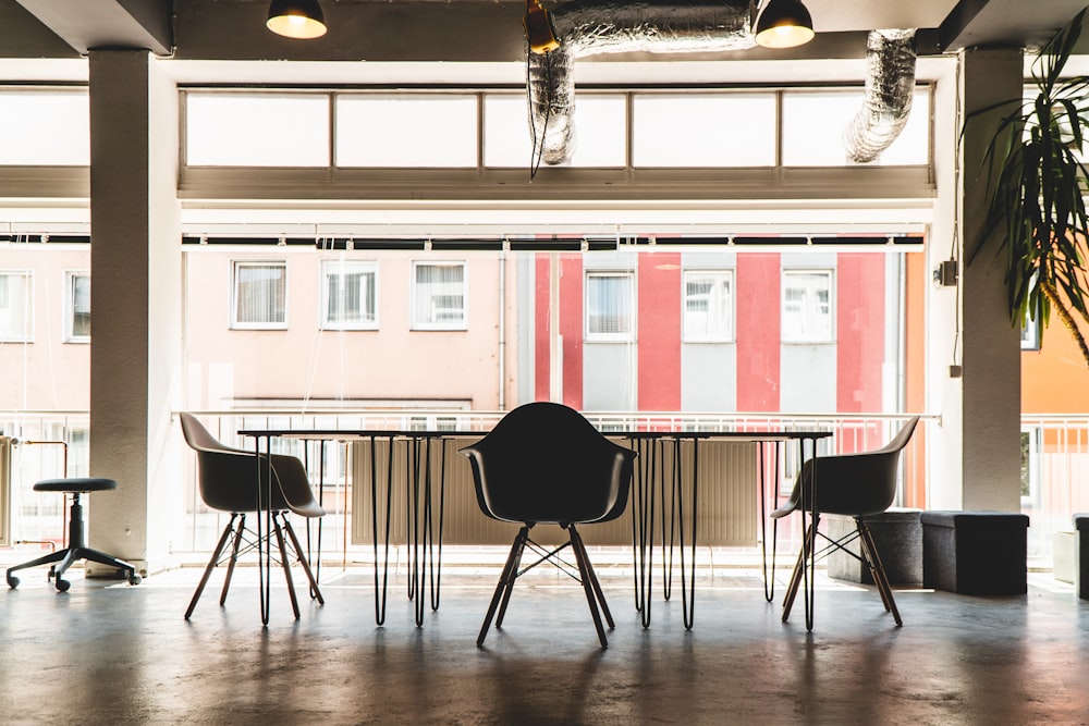 black and white wooden table and chairs