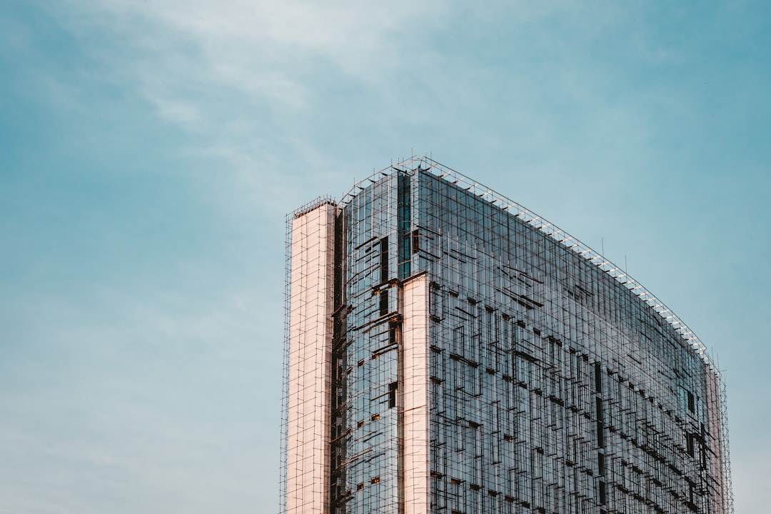 brown and gray concrete building under blue sky during daytime