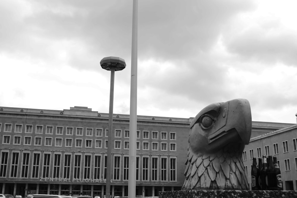 grayscale photo of a man statue