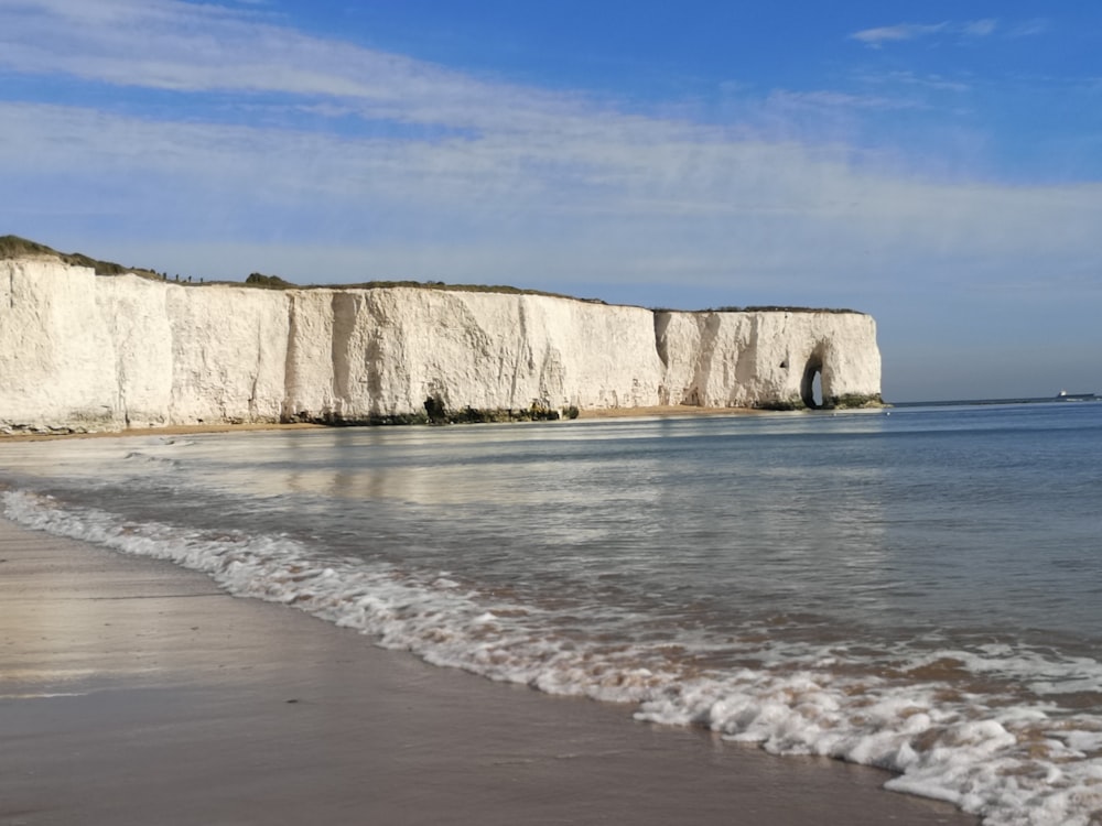 brown rock formation on sea shore during daytime