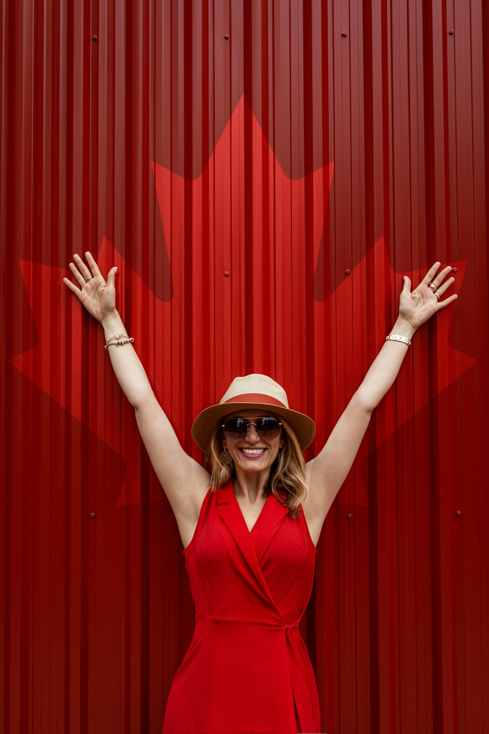 woman in red v neck shirt wearing brown hat