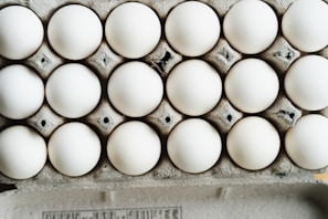 Close-up of neatly packed brown eggs in a carton at HMS Egg Distributors warehouse