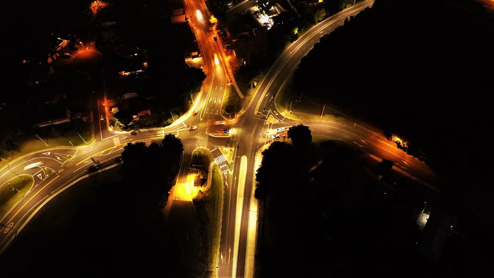 an aerial view of an intersection at night