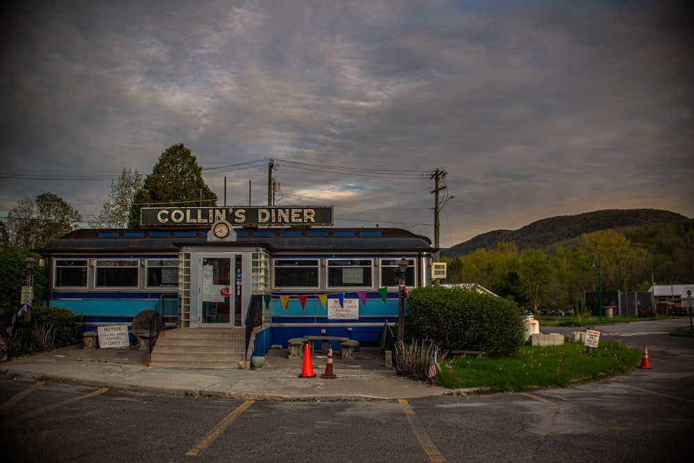 blue and white food truck on road during daytime