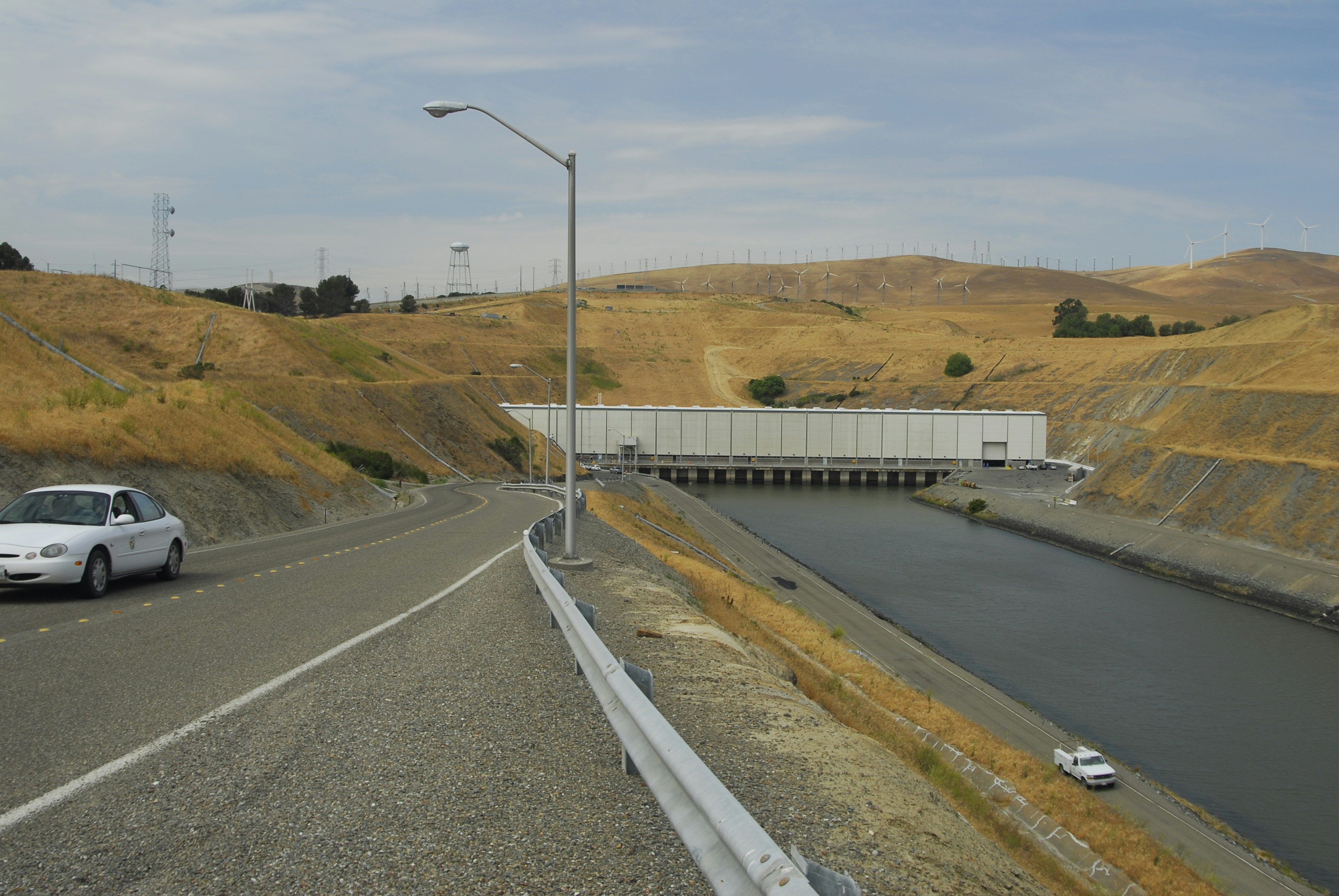 gray concrete road near green grass field during daytime, Harvey O. Banks Pumping Station