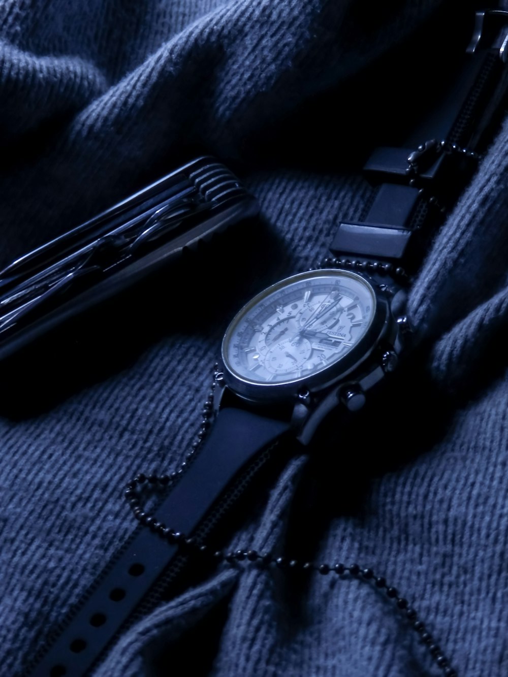 black leather strap silver round chronograph watch