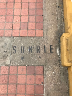 A friendly Citrus County Concrete Leveling technician speaking with a homeowner beside a freshly leveled sidewalk.