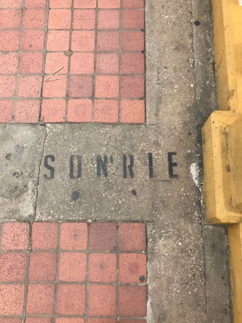 Sidewalk tiles restored to bright, fresh condition after our service.