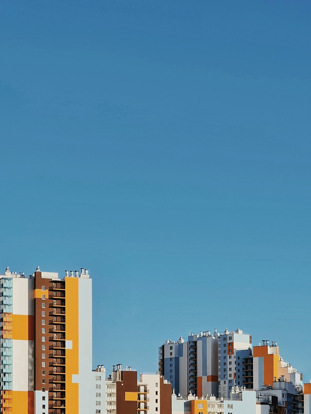 city buildings under blue sky during daytime