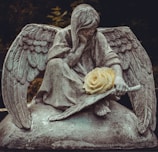 man sitting on rock statue
