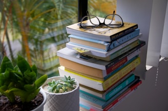 black framed eyeglasses on books