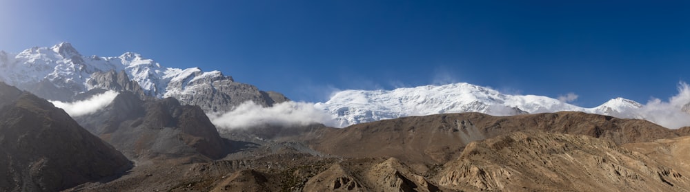 brown and white mountains under blue sky during daytime