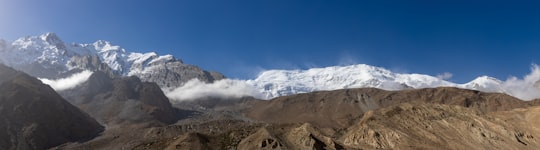 brown and white mountains under blue sky during daytime in Akto County China