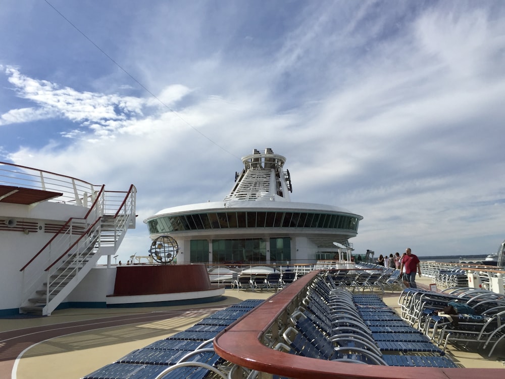 white and red ship on dock during daytime