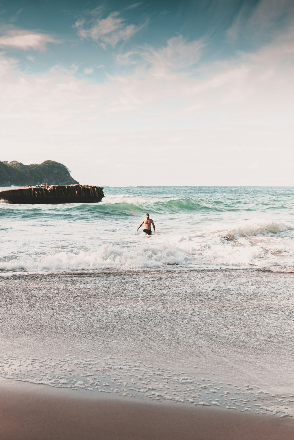 man surfing on sea waves during daytime