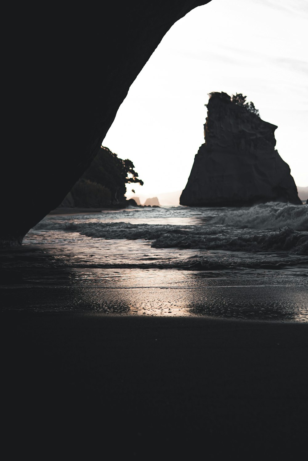 brown rock formation on sea during daytime