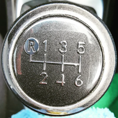 Close-up of a TH700-R4 transmission showcasing its intricate gears and polished metal surfaces.