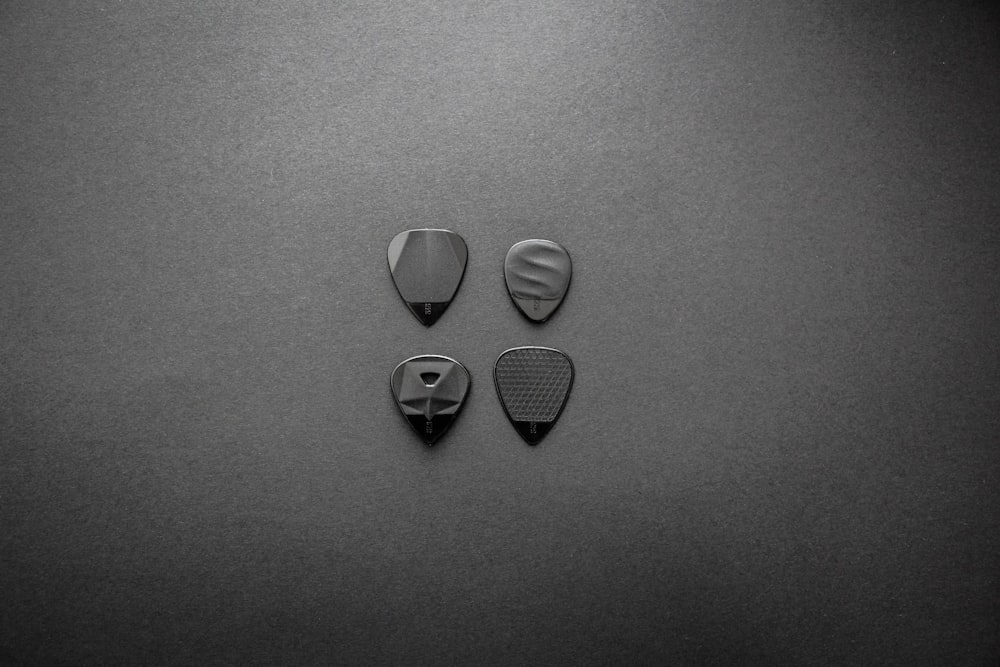 2 heart shaped gray stones