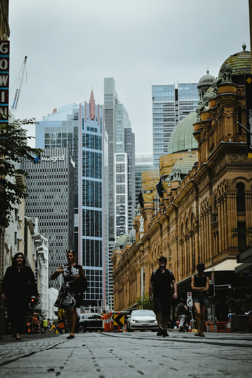 people walking on street near buildings during daytime