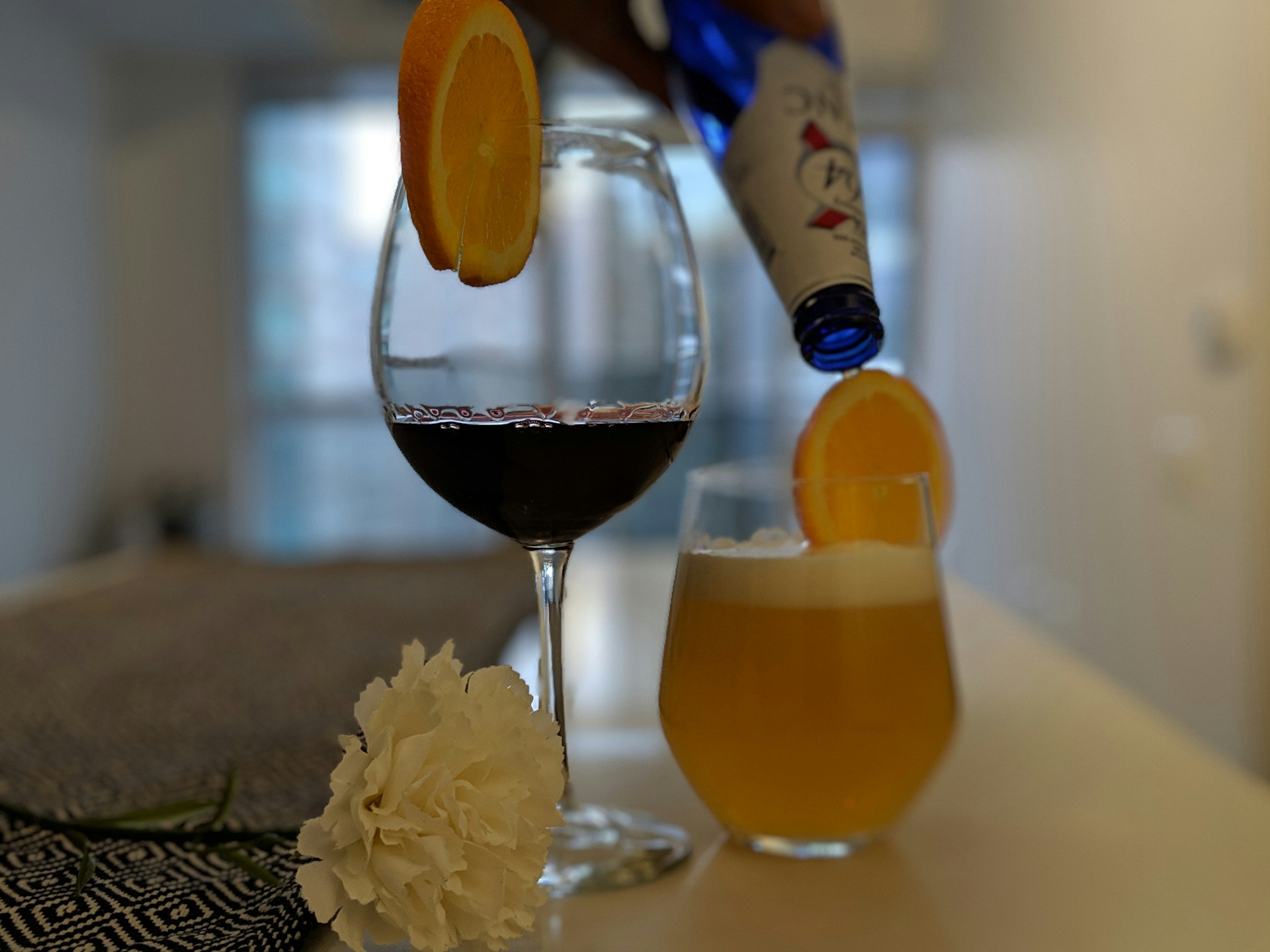 A stylish table setting featuring an assortment of New Mix drinks alongside Viña Real wine bottles.