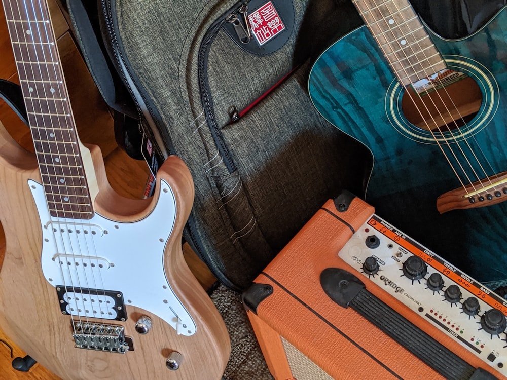 brown and white electric guitar