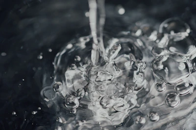 water droplets on body of water